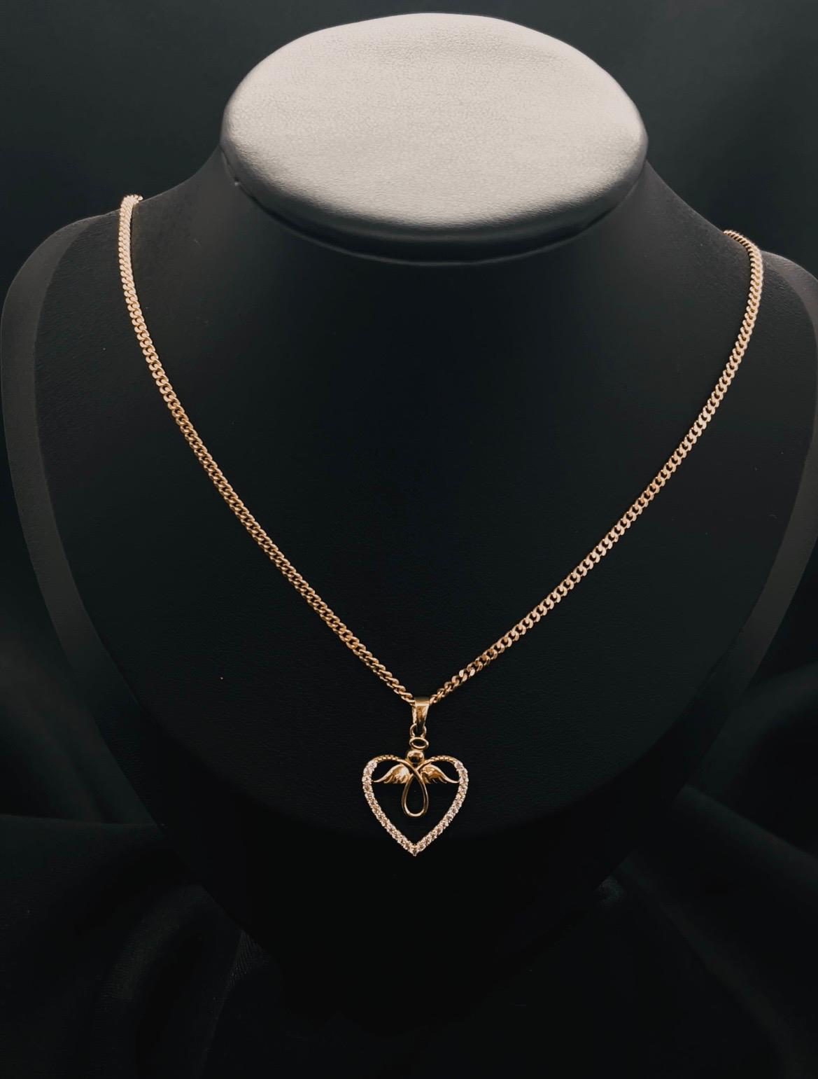 10K Yellow Gold Heart And Angle Pendent With Cz