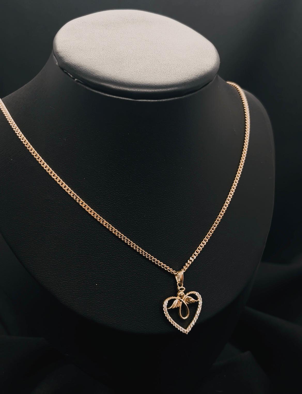 10K Yellow Gold Heart And Angle Pendent With Cz